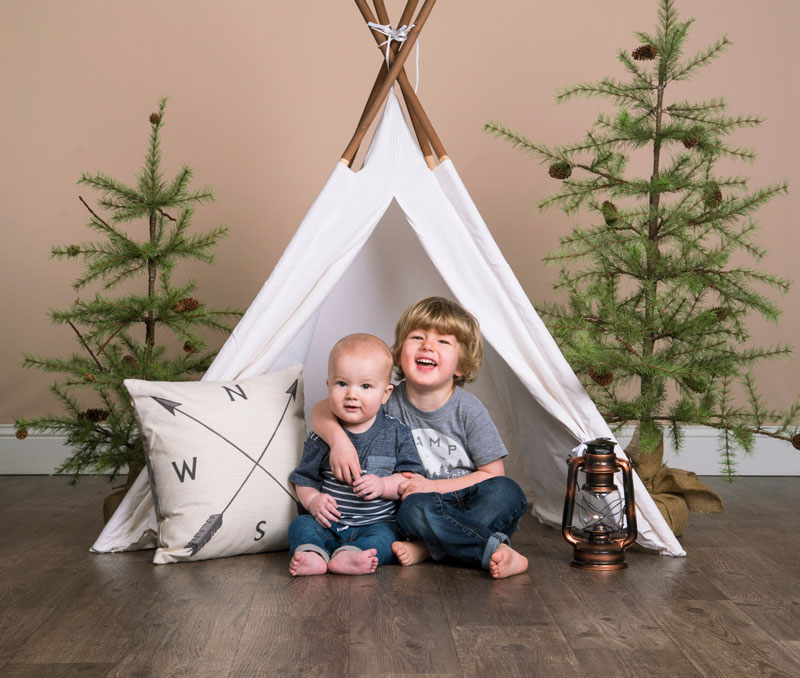 JCPenney Studio Photography ideas - Two young boys posed with happy camper theme props
