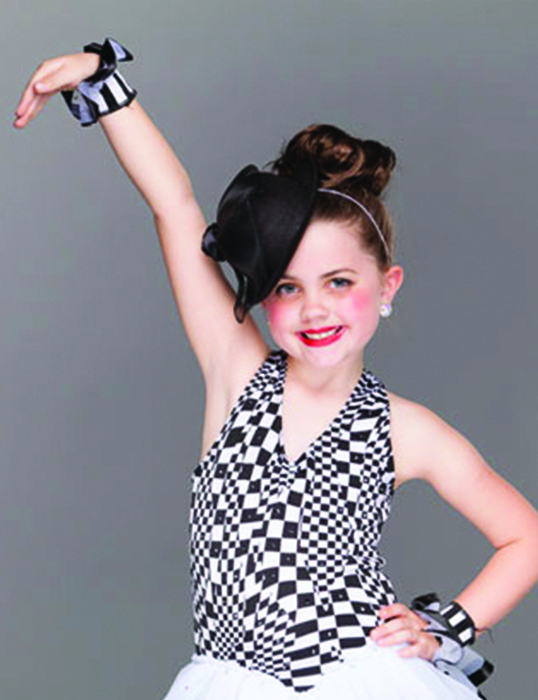 Special Events - Little girl dance pose in black and white dress
