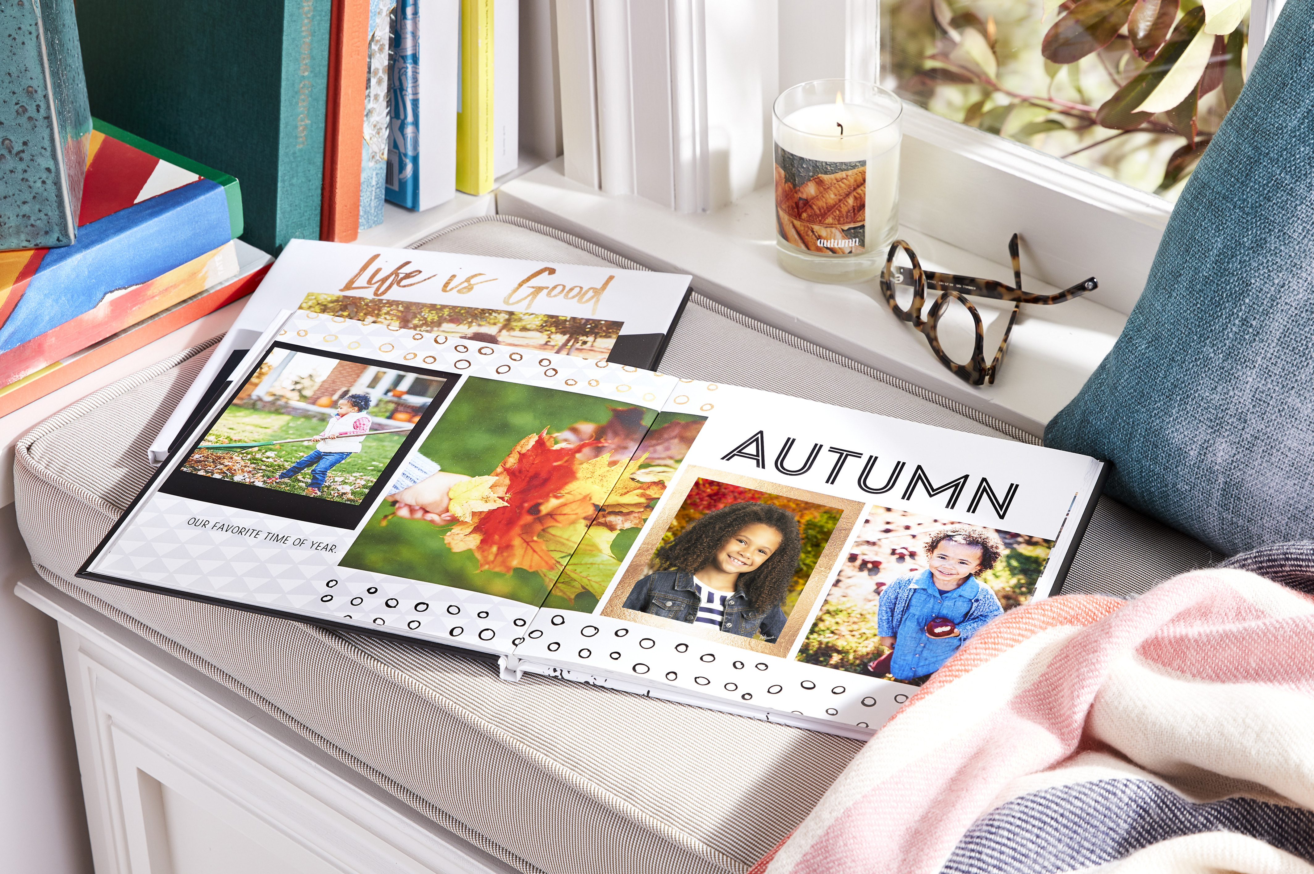 Lifetstyle image of a desk featuring school picture day images in a photo book.