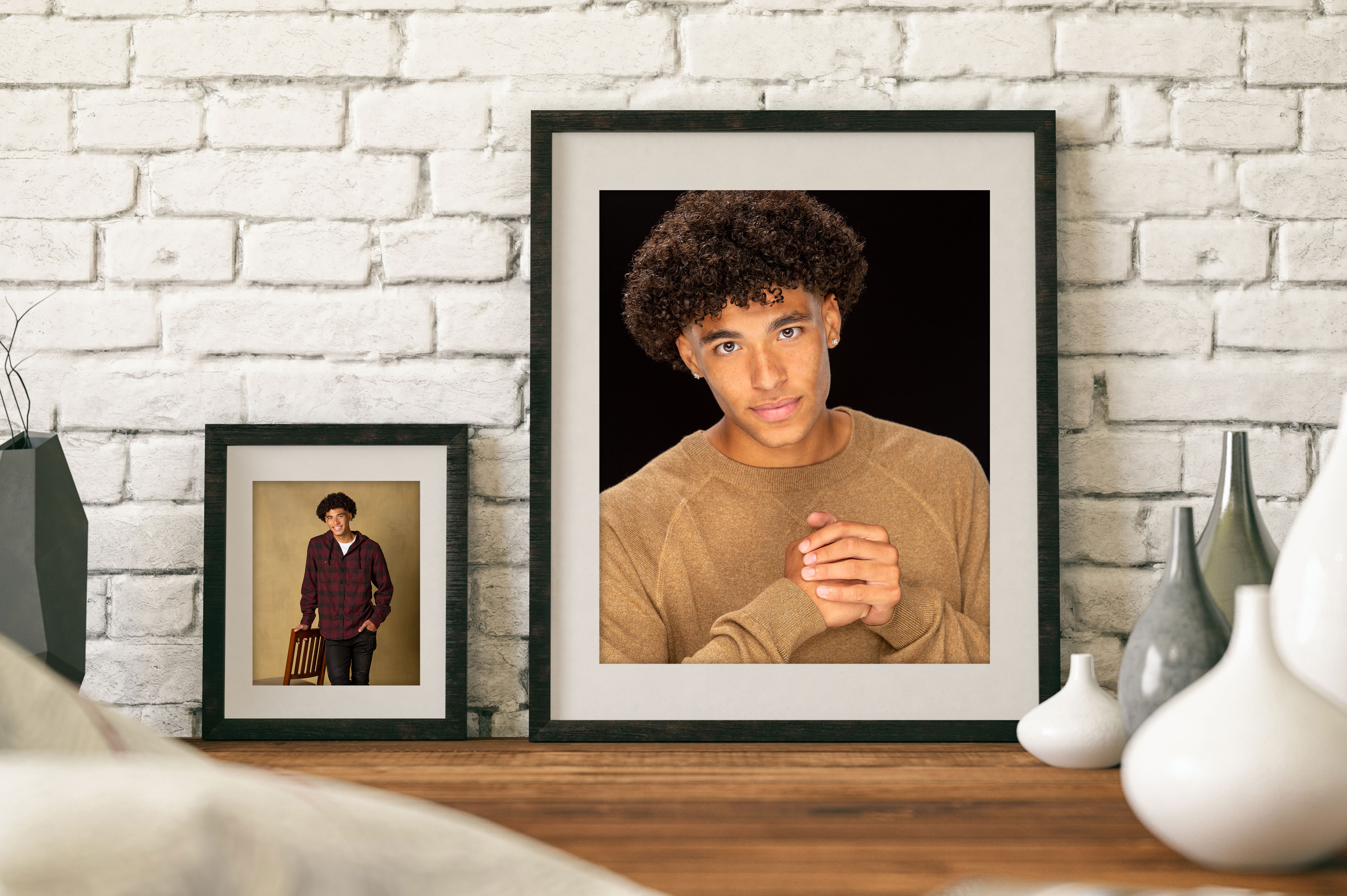Senior photography displayed on a wooden desk