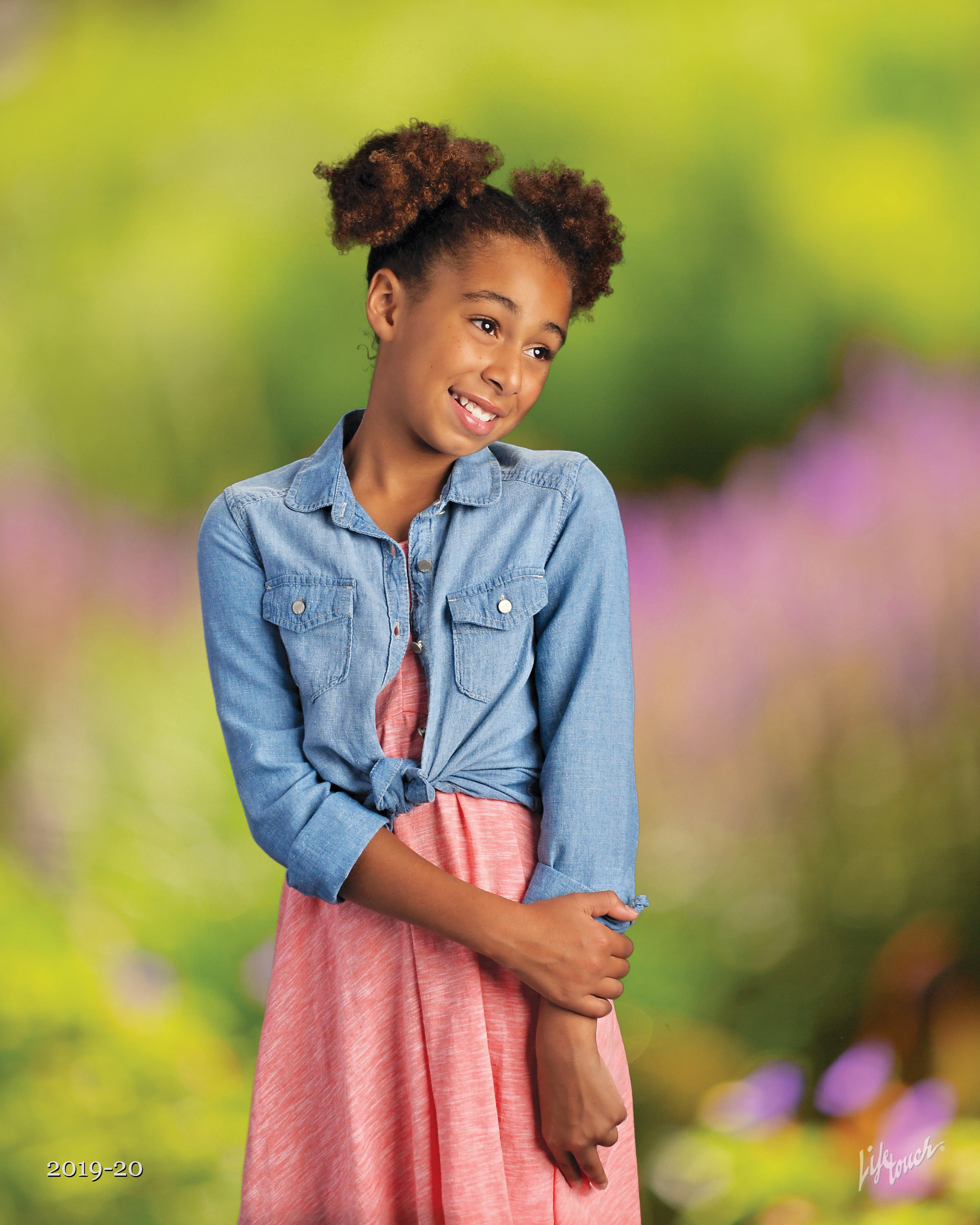 Girl in denim jacket on spring photography background