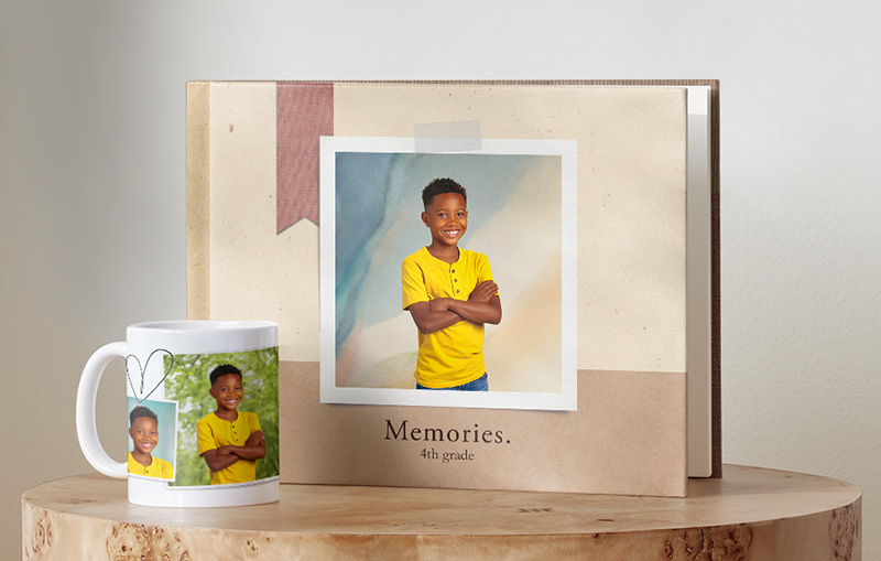 White frame sitting on a desk with child's school photo inside frame.